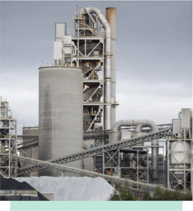 Cement grinding mill with multiple grinding chambers, orange feed chutes, and circular base platform.